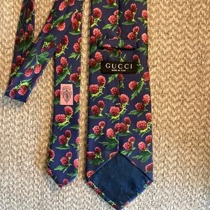 Gucci tie.   Blue with raspberries